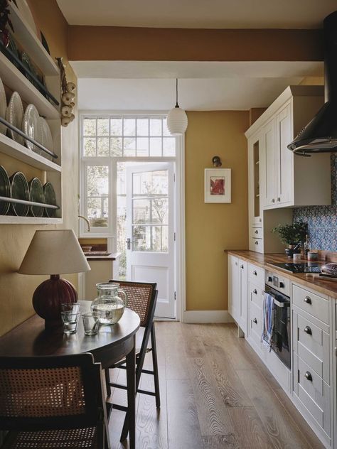 A sensitive renovation of a period property combining bold colour with personal treasures. The eclectic mix of styles and influences combine to create a home full of character and thoughtful design details. Olive Living Rooms, Edwardian Home, Greek Heritage, House Essentials, Edwardian House, London Home, Boutique Interior Design, Black And White Tiles, Boutique Interior