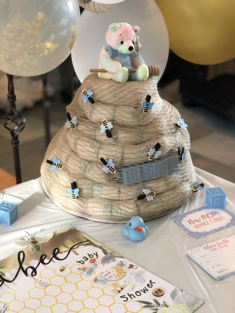 Bee Hive Diaper Cake, Winnie The Pooh Diaper Cake Ideas, Beehive Diaper Cake, Diaper Bouquet Diy, Bee Diaper Cake, Winnie The Pooh Diaper Cake, Pooh Diaper Cake, Baby Shower Boy Ideas, Baby Sock Bouquet