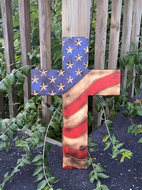 For God and country. Honor your beliefs and show your American pride in our cross flag. This flag has amazing detail and is absolutely gorgeous. Material/Finish: Baltic Birch or Pine, finished with gloss polyurethane or Shellac for high shine. Sizing: May vary slightly Large 21.75 inches in Height by 14.5 inches in width. Can be customizable with sizes/colors/stains just ask and I'll see what I can do (cost may vary). Blue/red/green etc. stencils, logos and designs available. Turnaround time is Picket Projects, Ag Projects, Patriotic Artwork, American Flag Cross, Wooden Cross Crafts, Christian Crosses, God And Country, Woodwork Designs, Western Rooms