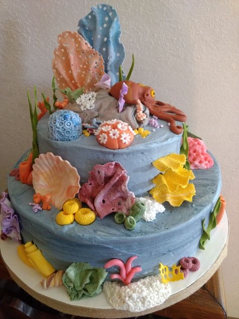 Fondant coral reef octopus cake Reef Cake, Coral Reef Cake, Coral Reef Birthday Cake, Fondant Coral, Fondant Coral Reef, Deep Sea Cake Ideas, Under The Sea Fondant Cake, Octopus Cake, Royal Icing Flowers