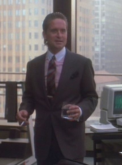 Gordon Gekko’s Dark Gray Peak-Lapel Suit in Wall Street | BAMF Style Wall Street Style Men, Gordon Gekko Wall Street, Italian Guys, New York City Spring, Gordon Gekko, Club Collar Shirt, Stone Costume, Classic Film Noir, Grey Wool Suit