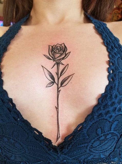 Rose tattoo mid chest Rose Tattoo In Middle Of Chest, Rose Chest Tattoos Female, Rose Tattoo On Chest Female, Rose Tattoo Under Breast, Rose Tattoo On Chest, Sternum Tattoos For Women, Women Sternum Tattoo, Mandala Sternum Tattoo, Rose Chest Tattoo