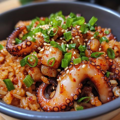 🔥 Dive into Nakji Bokkeumbap—a spicy, savory stir-fried octopus rice that's packed with flavor! 🐙🌶️ #NakjiBokkeumbap #SpicyOctopusRice Nakji Bokkeumbap (Spicy Stir-Fried Octopus Rice) Ingredients: Octopus (1 lb, cleaned and sliced) Cooked rice (2 cups) Gochujang (2 tbsp) Soy sauce (2 tbsp) Sesame oil (1 tbsp) Garlic (3 cloves, minced) Green onions (2, chopped) Instructions: Sauté octopus with garlic in sesame oil until cooked. Add gochujang and soy sauce, then stir in rice. Cook until eve... Fried Octopus, Noodle Art, Instagram Recipes, Cooked Rice, Rice Ingredients, Trending Recipes, Sesame Oil, Yummy Foods, Green Onions