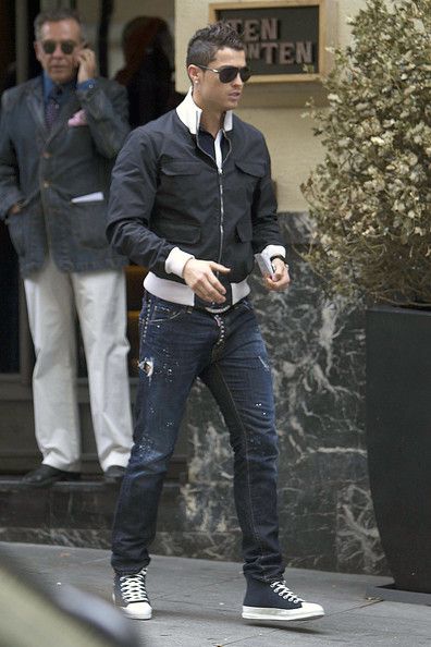 Hot look! Soccer star Cristiano Ronaldo was spotted exiting a popular restaurant in Madrid styled in a few of his favorite brands. He wore a navy Gucci water repellent bomber jacket ($1,070), Dsquared2 denim jeans ($1,055), and a pair of Louis Vuitton Fastball sneakers ($660). Ronaldo Drip, Cristiano Ronaldo Madrid, Ronaldo Madrid, Cristiano Ronaldo Style, Cristiano Ronaldo Junior, Ronaldo Junior, Mens Fashion Edgy, Cristiano Ronaldo Cr7, Mens Fashion Smart