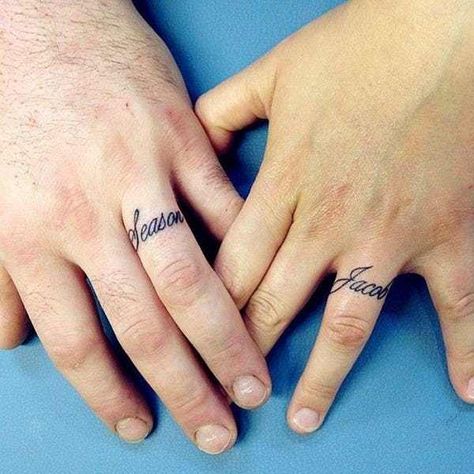 Looking for an awesome ring tattoo? You've come to the right place. This list rounds up some incredible ring tattoo designs, from simple black ink patterns to colorful, intricate works of body art. Some ring tattoos even span multiple fingers. All of these ring tattoos are a reflection of the... Engagement Tattoos, Wedding Ring Finger Tattoos, Married Couple Tattoos, Ring Tattoo Designs, Wedding Band Tattoo, J Tattoo, Wedding Ring Finger, Wedding Ring Tattoo, Tattoo Wedding Rings