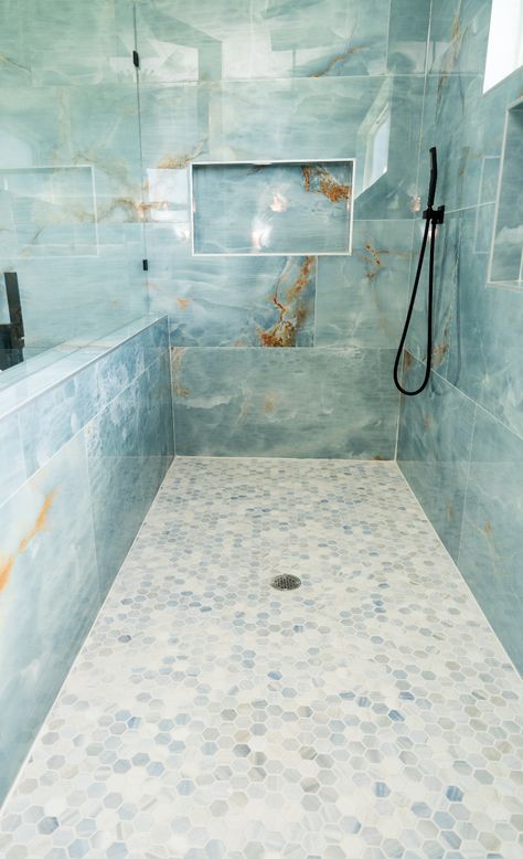 Bring the calm of the ocean into your bathroom with this stunning blue/green tile combo 🌊. From the walls of your shower to the floor, this design creates a relaxing, spa-like retreat. Want to create your own serene bathroom?

We’re here to help with expert tile advice! DM us today to get started. 💧

#bathroomdesign #showertiles #greentiles #bluevibes #tileinspiration Teal Tile Shower Ideas, Shower Tile Design, Blue Green Tile, Teal Tile, Green Tiles, Serene Bathroom, Spa Like Bathroom, Tranquil Retreat, Blue Tile