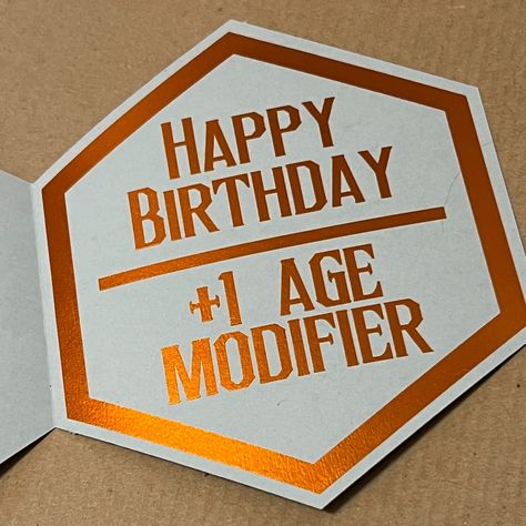 It was just my son's birthday, and since he is 31 and a gamer I wanted to make him a card that was really unique to his hobby. The first two images are the card I came up with, and designed myself. I was so happy when he saw it and immediately took a photo of it to post in one of his groups to his friends. Well THAT inspired me to make the entire design into a shadow box! That is what I am showing in the rest of the photos. The best part is that I have both of these designs as SVG files ... Dnd Party, Son's Birthday, Dragons Gift, Birthday Card Design, Cricut Cards, My Son Birthday, Card Designs, Cricut Svg, Drawing Inspiration