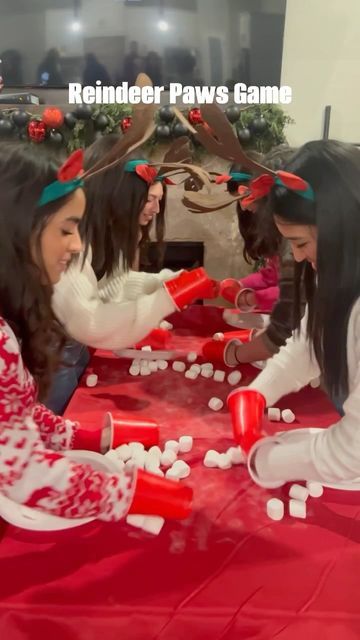 Rebeca Ciavarino • Fort Worth on Instagram: "Another Christmas Game for y’all! 🎄🥰 I think next time I would add an extra table for more room. For this game we used red solo cups and marshmallows. I got the reindeer headbands from Amazon. Linked in my bio 🦌🎅🏽 . . . . . . Christmas game. Family game night. Party game. #christmas #christmastime #christmasdecor #party #christmasparty #holidayparty #family #gamenight #familygoals #reindeer #thanksgiving" Red Cup Games For Kids, Reindeer Paws Game, Marshmallow Christmas Game, Reindeer Games For Toddlers, Christmas Games With Red Solo Cups, Reindeer Hooves Game, Christmas Games For Family With Solo Cups, Solo Cup Games For Christmas, Family Christmas Games Using Solo Cups