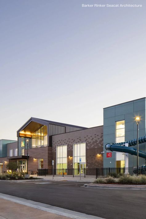 Located in Northglenn, Colorado, Northglenn Recreation Center offers the community a performing arts theater, swimming pools, senior center, and more for them to use. Max Compact Exterior HPL panels from Fundermax were combined with other woodgrain and plain color panels, giving the facade this sense of modernity through the natural material decor AF Patina. For more project images and information, visit: https://fundermax.us/projects/northglenn-recreation-center/ Community Recreation Center, Performing Arts Theater, Leisure Pools, Senior Center, Sims House Design, Recreation Centers, Theatre Arts, Plain Color, Sims House