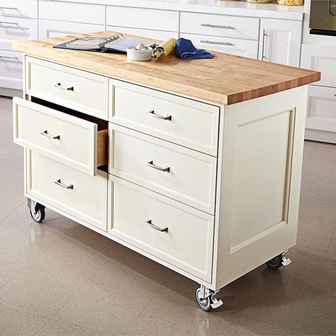 Rolling kitchen island woodworking plan. Kitchens and workshops are a lot alike: Neither ever seems to have enough storage or worksurface. This rolling cabinet you can make in your workshop will neatly solve both kitchen problems with a generously sized maple top plus three roomy drawers and slide-out space for trash and recycling bins. Kitchen Island With Drawers, Portable Kitchen Island, Kitchen Island On Wheels, Kitchen Island Plans, Rolling Kitchen Island, Kitchen Island Cart, Portable Kitchen, Diy Kitchen Island, Kitchen Island Design