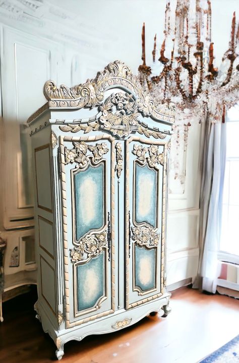 "SOLD.  DO NOT PURCHASE. Country french style armoire with black accents. Lightly distressed and aged to perfection with subtle gold highlights. This piece was lovingly handpainted in a calming light blue and \"antiqued\" for that old world feel. A pair of love birds and floral motifs top off her crown. 99H by 50W by 24D." Boho Wardrobe Furniture, Painted Secretary, Country French Style, Old Wardrobe, Dresser Wardrobe, French Painted Furniture, Armoire Dresser, Cottage French, French Country Shabby Chic