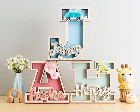 Welcome to the enchanting world of Baby Letter Bank, where imagination meets practicality! Our personalized name money banks are the perfect blend of charm and functionality, ideal for kids' birthdays, baby gifts, or christening celebrations. Crafted with love, these wooden name boxes make saving money a delightful adventure for little ones. These Coin Bank are 100% handmade with High Quality Plywood and Arcylic DETAIL: - Height:  + 7 inches ~ 17.5cm + 9 inches ~ 22.5cm + 11 inches ~ 27.5cm - De Custom Piggy Bank, Wooden Piggy Bank, Baby Letters, Kids Money, Nursery Decor Boy, Wooden Letter, Piggy Banks, Personalized Gifts For Kids, Kids Discover