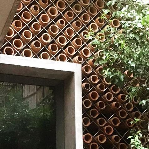 CoolAnt on Instagram: "A modular facade created with the help of our pots, in a waiting room for an office space in New Delhi, with a floor area of approx. 200 sq. ft.  The system is capable of cooling down the entire space, using natural means, such as evaporative cooling. This will also have provisions to control the ventilation for the room.  The facade is a composite of glass openable windows, and CoolAnt pots, along with a sensor-based water system, all integrated together by design.  Follow @coolant.co for more updates.   #coolant #coolantbeehive #sustainable #modularfacade #pots #naturalcooling #evaporativecooling #passivecooling #climate #terracotta #ecocooling #jaali #unido #sangam #vernaculararchitecture #handmade #naturalairconditioning #antstudio" Terracotta Cooling System, Modular Facade, Sustainable Facade, Leto Atreides, Sustainable Homestead, Eco House Design, Evaporative Cooling, Jaali Design, Passive Cooling