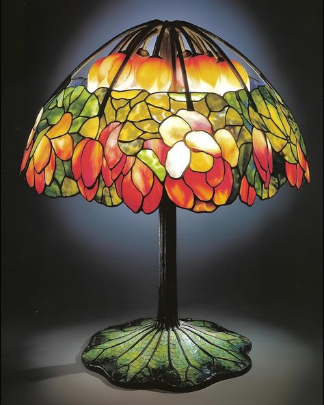 Louis Comfort Tiffany‘s artistic philosophy was deeply rooted in his reverence for the natural world and its infinite beauty. He saw nature as a boundless wellspring of inspiration, from the delicate petals of flowers to the sweeping vistas of landscapes. Tiffany believed in the transformative power of color and light, utilizing innovative glassmaking techniques to create pieces that radiated with luminosity and depth. His exploration of opalescent glass and layered textures allowed him to ca... Louis Tiffany, Color And Light, Louis Comfort Tiffany, Glass Lamps, Stained Glass Lamps, The Natural World, Applied Arts, Tiffany And Co, Stained Glass Patterns