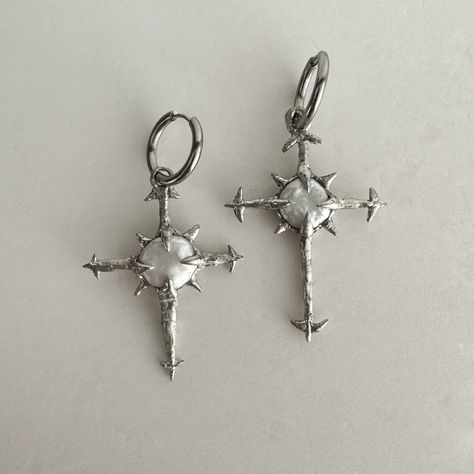 Edgy and unique cross earrings, the hoops are 100% stainless steel. The cross is made of fresh water pearl in the center, and tin plated cooper around it. Each piece is hand made. Please follow the care instruction for that come with the package.  We ship in 1-3 days. All orders come with complimentary jewelry box and pouch. Goth Cross Earrings, Grunge Silver Jewelry, Welded Jewelry, Earrings Grunge, Silver Earrings Hoops, Silver Hoops Earrings, Earrings Edgy, Earrings Silver Hoops, Grunge Earrings