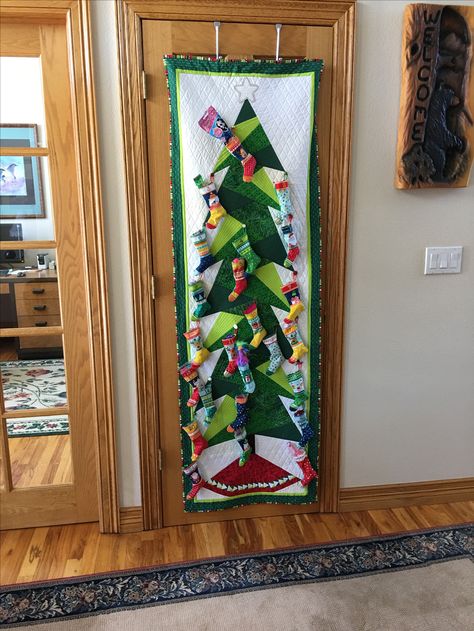 Advent stockings (Panel by Makower UK) on Tall Trim A Tree (pattern by Cindi Edgerton) made for my granddaughter, Zailyn in 2017. She ‘s 6 yrs old. Cindi Edgerton, Quilt Christmas, For My Granddaughter, Ribbon On Christmas Tree, Winter Quilts, Foundation Piecing, Tree Pattern, Tree Patterns, The Tree