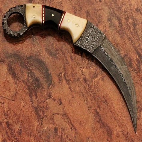 Get your hands on these beautiful handmade Damascus karambit knives with bone handles! Perfect for hunting, survival or everyday carry. Full tang blades made from high-quality Damascus steel. Available in a variety of styles and colors. Don't miss out on this unique collection! #damascusknife #karambitknife #huntingknife #survivalknife #handmadeknife  #SheathIncluded #Damascus #Hunting #Survival #eBaySeller #EverydayCarry #eBayStore #Ambidextrous #DamascusSteel #Combat Knife Handle Making, Mens Toys, Karambit Knife, Damascus Steel Knife, Knife Handle, Knife Collection, Damascus Knife, Cool Knives, Knife Handles