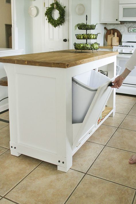 By adding pull-out trash storage to an island or cabinet, you can spare your kitchen of an eyesore, plus open up your floor space. (Sounds like a win-win to us!) Kitchen Island In Narrow Kitchen, Diy Kitchen Island With Trash Storage, Diy Mobile Kitchen Island, Kitchen Island With Trash Pull Out, Diy Kitchen Island With Storage, Rolling Kitchen Island Ideas, Diy Kitchen Island On Wheels, Diy Rolling Kitchen Island, Kitchen Island Building Plans