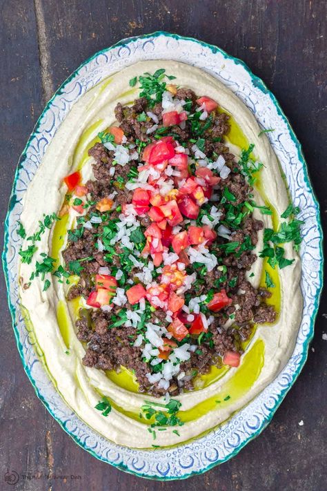 Layered Hummus Dip, Layered Hummus, Hummus Recipe Homemade, Hummus Dip, The Mediterranean Dish, Spiced Beef, Make Hummus, Homemade Hummus, Toasted Pine Nuts