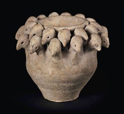 A SYRIAN POTTERY BIRD CUP CIRCA 1800-1600 B.C. The rounded body tapering to a flat base, with 26 bird heads emerging from the shoulders, arranged in two tiers, with indented eyes and pointed beaks 3 7/8 in. (9.9 cm.) diameter Historic Pottery, Historical Pottery, Historic Ceramics, Paper Objects, Ancient Ceramics, Bird Cup, Pottery Lessons, Ancient Pottery, Ancient Sculpture