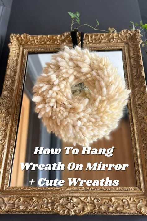 How To Hang Wreath On Mirror + Cute Examples - Pink Pop Design Christmas Wreath Over Mirror, How To Hang Wreath On Mirror, Mirror Wreath Decor, Wreath On Mirror Ideas, Wreath On Mirror Christmas, How To Decorate A Mirror For Christmas, Christmas Wreath On Mirror, Wreaths On Mirrors, Mirror With Wreath