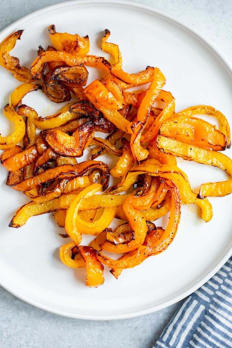 Air fryer bell peppers get perfectly roasted in the air fryer. These air fried peppers can be used in a variety of ways, and take less than 15 minutes to cook. Bell Pepper Chips, Air Fryer Bell Peppers, Chips Air Fryer, Dehydrated Banana Chips, Vegan Zucchini Bread, How To Make A Poached Egg, Fried Peppers, Ways To Cook Eggs, Parmesan Green Beans