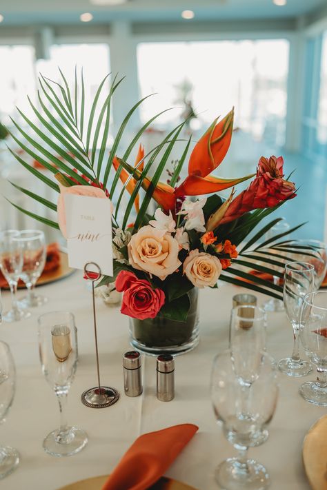 Bringing a touch of the tropics to the table. 🏝️  Venue: @harborviewloft Catering: @personaltouchdining Photography: @laurenogdenphoto Florist: @undetalle_floraldesign   #harborviewloft #personaltouchdining #couples #bride #groom #wedding #ido  #diversity #LGBTQIA #waterfrontweddings #sandiegoeventplanner #sandiegoeventvenue #outdoorceremony #allinclusivevenue #allinclusivewedding #sandiegoweddings #downtownsandiego #weddingvenue #eventvenue #sdcatering #sdfoodie #destinationwedding Fall Tropical Wedding Flowers, Tropical Simple Wedding, Tropical Spring Wedding, Wedding Table Decorations Tropical, Fall Hawaiian Wedding, Tropical Wedding Arch Ideas, Boho Tropical Wedding Decor, Chic Tropical Wedding, Tropical Reception Decor