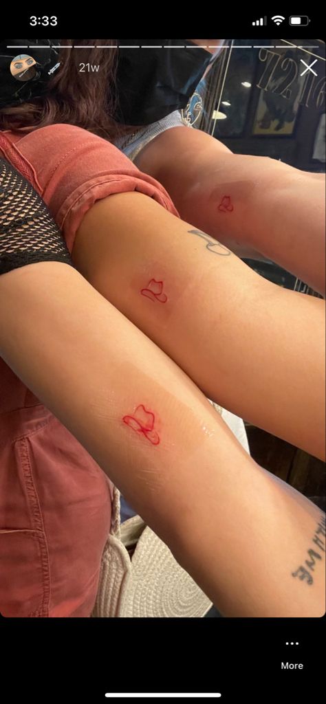 little red tattoo of a cowboy hat matching with friends Best Friend Tattoos Cowboy Hat, Red Cowboy Hat Tattoo, Texas Boot Tattoo, Nashville Friend Tattoos, Cowboy Hat Tattoo Behind Ear, Small Tattoos Nashville, Red Cowboy Boots Tattoo, Dainty Cowboy Hat Tattoo, Cowboy Boots And Hat Tattoo