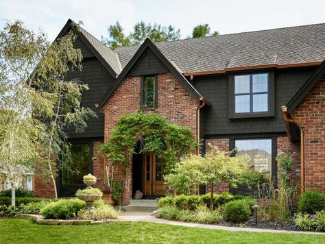 Our siding is painted a version of Iron Ore by Sherwin-Williams (I had them remove the maroon tones). The paint store will tweak any color — just ask! 1980s Home Remodel Exterior, Brick House With Dark Siding, Red Brick Dark Siding, Black Siding With Brick, Red Brick With Black Siding, Red Brick Craftsman Exterior, Black Soffit And Fascia Red Brick, Red Brick And Black Exterior, Black And Brick House Exterior