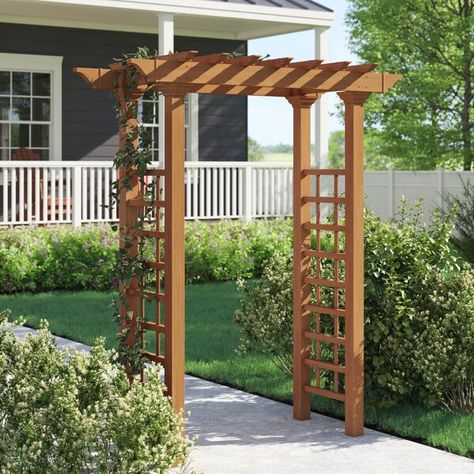 Frame a walkway or spruce up a garden space with this classic arbor. Designed to mimic the look of wood without the maintenance, this clean-lined design is crafted from composite vinyl in a warm walnut brown finish to resist cracking, rotting, UV, mildew, warping, and weather. Plus, the manufacturer backs this product with a 10-year warranty. Mounting stakes are included to secure this design into your yard. Garden Kaleidoscope, Guess House, Arbor Gate, New England Arbors, Garden Arch Trellis, Wood Arbor, Wooden Arbor, Gazebo Ideas, Trellis Ideas