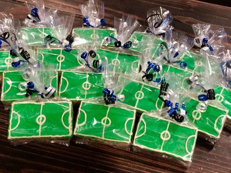 Soccer Field rice crispy treats with royal icing for soccer signing party💙⚽️💙 Soccer Party Treats, Soccer Rice Krispie Treats, Soccer Rice Crispy Treats, Soccer Treats For Kids, Kids Soccer Game Snack Ideas, Soccer Theme Birthday Party Decorations Dessert Tables, Soccer Mom Snacks, Soccer Treats, Soccer Party Decorations