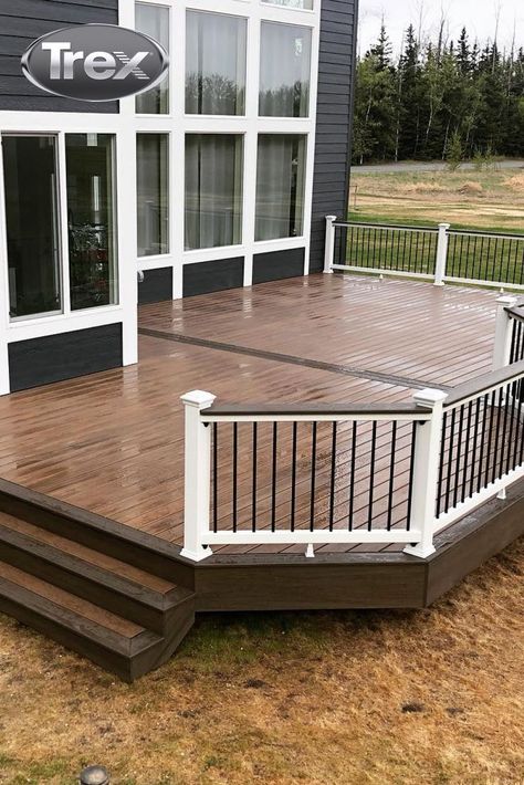 Trex. Designed for real life. Spills, sunshine, and afternoon showers welcome. ☔ Click the link to learn more about Trex composite decking.

🛠️&📸: highland.construction Brown And Black Trex Deck, Two Tone Trex Decking, Deck Trex Ideas, Trex Deck Lighting Ideas, Front Porch Trex Decking, Dark Grey House With Deck, Trex Decks And Porches, Composite Deck Designs Ideas, Trex Woodland Brown Deck