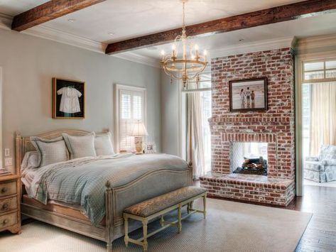 35 Gorgeous Natural Brick Fireplace Ideas (Part 2) Wrapped Beams, Refinish Cabinets, Rustic Beams, Design Camino, Traditional Bedroom Design, Update Kitchen, White Wainscoting, Bedroom Chandelier, Double Sided Fireplace