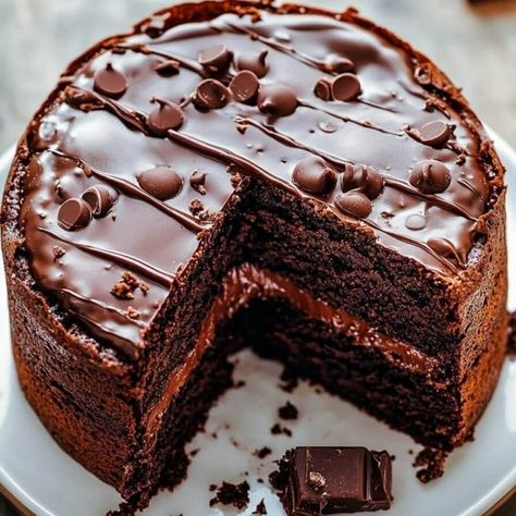 Chocolate Brownie Cake Recipe Brownie Chocolate Cake Recipe, Brownie Mix Chocolate Cake, Chocolate Brownie Cake With Ganache, Cake With Brownie Mix Recipe, Chocolate Potluck Desserts, Chocolate Fudge Brownie Cake, Chocolate Brownie Cake Recipe, Chocolate Fall Desserts, Vegetarian Chocolate Cake