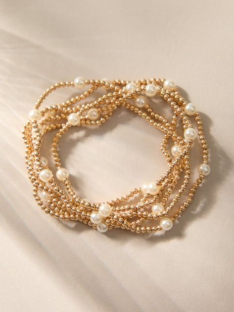 Stacking jewelry is a trend that will never go away, add to your bracelet collection with this set of gold and pearl stretch bracelets. Wear them together or pick and choose how many, these bracelets are dainty in design so they are cute on their own or powerful all together..#jewelrylover #handcraftedjewelry #jewelryinspiration #jewelrydesign #jewelryobsessed #jewelryoftheday #jewelrygoals #jewelryfashion #jewelrytrends Roller Rabbit Bracelet, Evry Jewels Bracelet Stack, White And Gold Bracelet Stack, Preppy Gold Bracelet Stack, Cute Fall Jewelry, Enewton Necklace Stacks, Preppy Jewelry Aesthetic, Gold Jewelry Aesthetic Bracelets, Altar'd State Jewelry