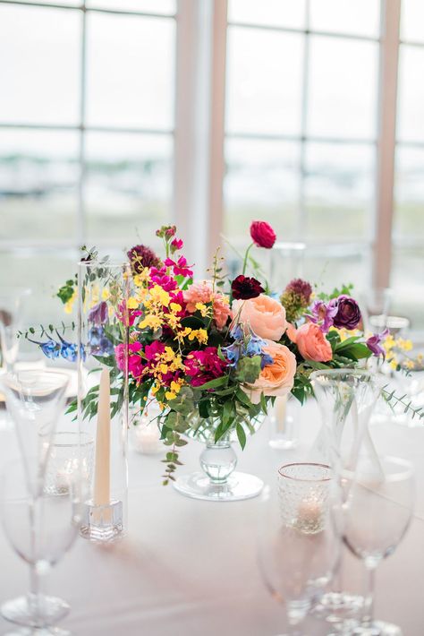 Colourful Floral Table Arrangements, Colorful Summer Wedding Centerpieces, Colorful Wedding Arrangements, Summer Wedding Keeping Cool, Colourful Centerpieces Wedding, Round Table Centerpieces Wedding Colorful, Wildflower Long Table Centerpiece, Bright Centerpiece Wedding, Vibrant Floral Centerpieces