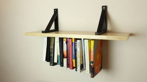 Double up on your display space with this unusual upside-down shelf. Start with a wooden board and a length of elastic. Reading Loft, Area Fashion, Hanging Bookshelves, Diy Dorm, Diy Bookshelf, Cottage Kitchen Design, Bookshelf Ideas, Dorm Diy, Dorm Room Diy