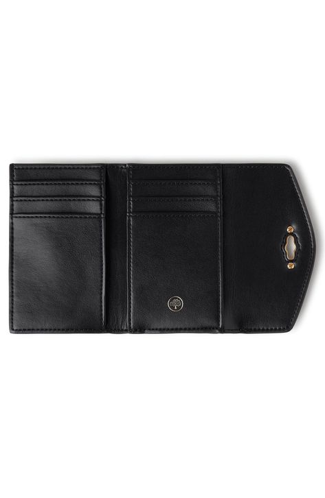 Crafted from grained Italian leather with a signature postman's lock, this trifold wallet opens to reveal a well-organized interior packed with card slots and pockets. Turnlock closure Exterior zip pocket Interior currency pocket; wall pockets; six card slots Leather Imported Designer Handbags Mulberry Darley, Christmas Basket, Leather Trifold Wallet, Christmas Baskets, Black Leather Wallet, Wall Pockets, Trifold Wallet, A Signature, Perfect Christmas