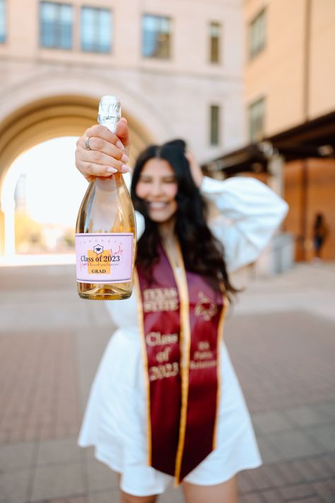 Tassel Graduation Pictures, Grad Photos With Champagne, College Graduation Champagne Bottle, Champagne Bottle Graduation Picture, College Grad Photoshoot Champagne, Grad Champagne Pic, Pink Graduation Cap And Gown Pictures, Grad Photos Champagne, College Graduation Pictures Masters