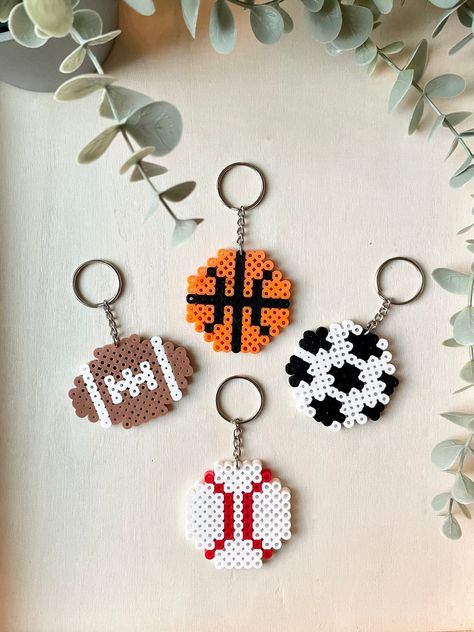 This listing is for one keychain. These are finished products ready to ship. These make excellent party favors or gifts. Need more? Send me a message, we will be happy to make more. (A discount is provided for large orders of 10+) Perler Bead Soccer Ball Pattern, Iron Beads Ideas Cute Easy, Sports Perler Bead Patterns, Kc Chiefs Perler Beads, Baseball Perler Bead Pattern, Perler Beads Basketball, Perler Beads Football, Soccer Perler Beads, Basketball Perler Beads