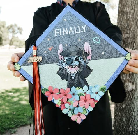 Disney’s Stitch themed graduation topper Up Cap Graduation, Grad Cap Ideas Lilo And Stitch, Decoration Cap Graduation, Graduation Cap Cartoon Designs, Grad Cap Ideas Stitch, Stitch Graduation Party Ideas, Lilo And Stitch Grad Cap, Graduation Topper Ideas, College Grad Cap Ideas Disney