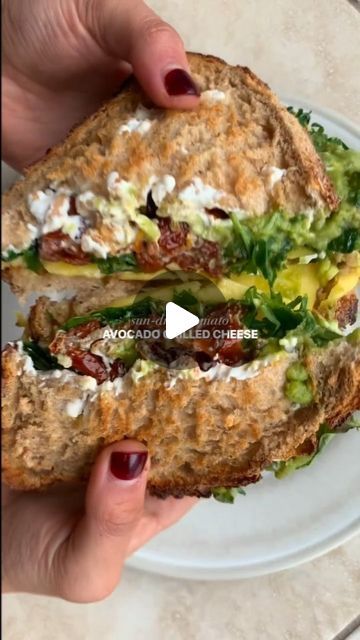 Healthy Eating on Instagram: "Video 🎥 by @healthfulradiance 

i think this sandwich may give all my other ones a run for their money… but someone should make them all just to confirm 😚 

consider this your weekly reminder that carbs are your friend 🙏 we’re all about balanced eats over here :)

sun-dried tomato avocado grilled cheese

toast two slices of sourdough to your liking, then spread/layer on the following:

- cream cheese (i used vegan)
- sun-dried tomato pieces 
- two slices of cheese (i used vegan provolone)
- arugula
- mashed avocado

sandwich the pieces together, brush both sides with butter or oil of choice, cook on the stovetop for 2-3 min on each side or until crispy and the cheese has melted. slice and enjoy!" Tomato Avocado Grilled Cheese, Avocado Grilled Cheese, Weekly Reminder, Tomato Avocado, Avocado Sandwich, Cheese Toast, Healthy Food Dishes, Mashed Avocado, Healthy Food Motivation