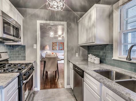 Beautiful small galley kitchen with white cabinets, juparana delicatus granite and porcelain tile floors Small Gallery Kitchen, Gallery Kitchen Layout, Delicatus Granite, Small Galley Kitchen Designs, Small Galley Kitchen Remodel, Galley Kitchen Layout, Small Galley Kitchen, Galley Kitchen Design, Galley Kitchen Remodel