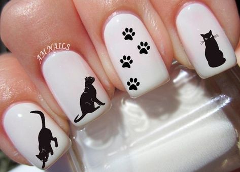 Black cat nail decals that'll be a sure hit for Halloween costumes or, you know, just your regular-degular cat-adoring day. 30 Stylish Things For People Who Love Cats More Than Hoomans Black Cat Nail, Lion Nails, Paw Print Nails, Cat Nail Designs, Water Nail Art, Ladybug Nails, Cat Nail Art, Nail Art Halloween, Cat Nail