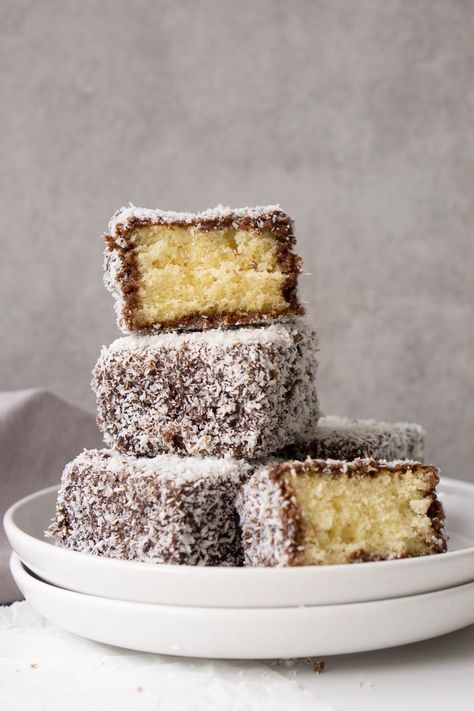 These classic lamingtons are a staple Australian recipe. A light and fluffy butter cake dunked in chocolate icing and then coated in coconut. There is a reason these lamingtons are an Aussie favourite! Coconut Squares, Brownie Vegan, Celebration Photography, Mousse Au Chocolat Torte, Tarte Fine, Coconut Desserts, Butter Milk, Sponge Cake Recipes, Sugar Glaze