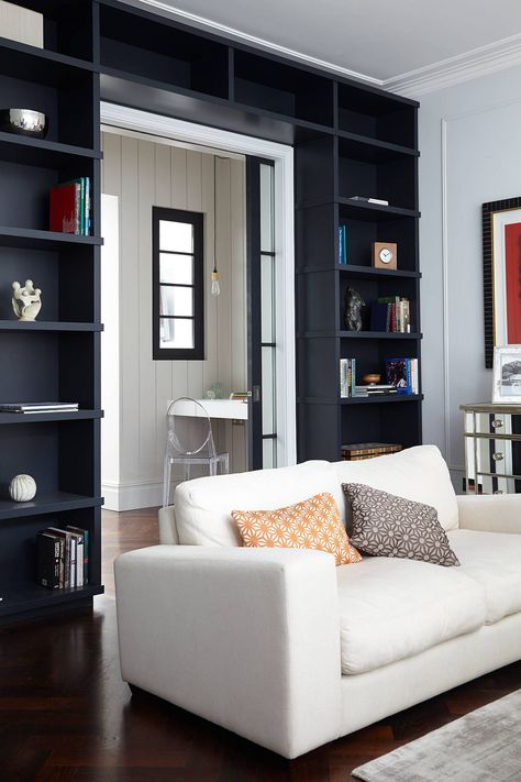 Maximizing Space in Eye-Catching Style #bookshelf #diybookshelf #diyhomedecor #library Shelves Around Doorway, Colorful Eclectic Living Room, Blakes London, Designing Tips, London Living Room, Patterned Cushions, Open Family Room, White Ghost, Transitional Living