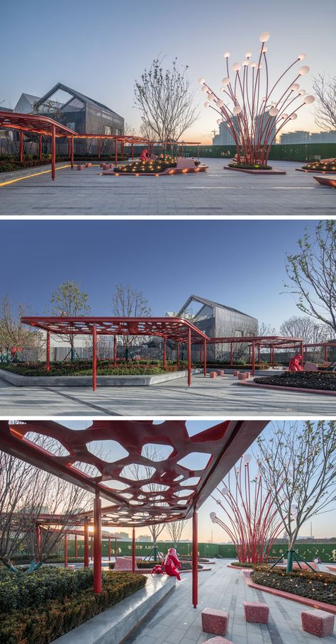 This modern public plaza has a variety of seating options, like a built-in concrete bench that sits underneath a red pergola and that wraps around the planters. #Park #Plaza #LandscapeDesign Street Design Public Spaces, Modern Park Design, Pergola Seating, Landscape Plaza, Public Plaza, House Garden Landscape, Plaza Design, Park Plaza, Concrete Bench