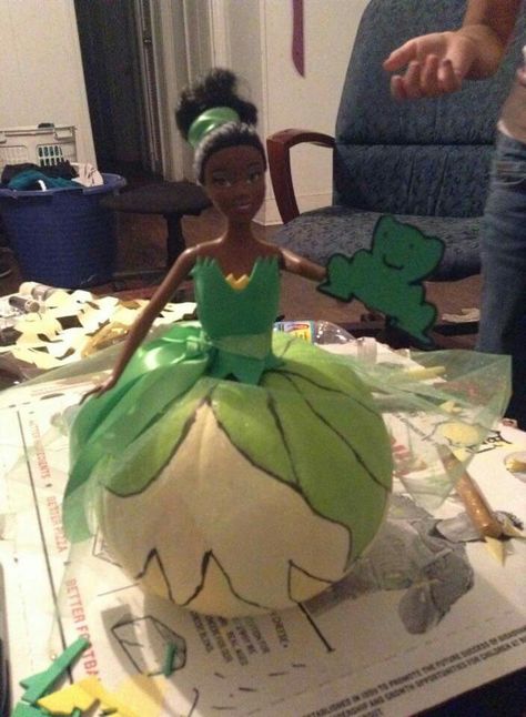 That's a pumpkin, paint and a barbie y'all! Pumpkin project, Princess & the Frog Princess Peach Pumpkin Painting, Princess And The Frog Pumpkin, Tiana Pumpkin, Barbie Pumpkin, Frog Pumpkin, Storybook Pumpkin, Halloween At Work, Disney Pumpkin Painting, Story Book Pumpkin