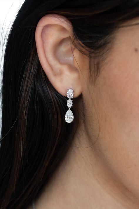 18k white gold dangling earrings with .77ct top ovals, .49ct middle ovals, and 2 .90ct pear shapes Solitaire Earrings, Diamond Jewelry Designs, Oval Earring, Dream Jewelry, Wedding Earrings, Pear Shaped, Pear, Diamond Jewelry, Wedding Planning