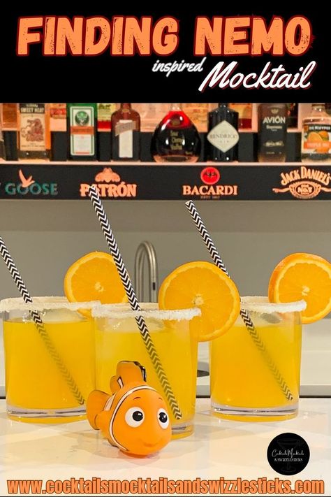 This image shows three orange mocktails with a white rim, orange wheel garnish and black and white striped straws with Nemo in front of them. Nemo Themed Birthday Party, Disney Movie Night Menu, Dory And Marlin, Nemo Baby Shower, Finding Nemo Movie, Finding Nemo Cake, Finding Nemo Baby, Disney Movie Night Food, Disney Inspired Cocktails